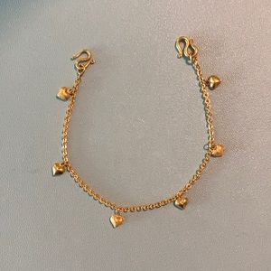 22 karat tiny heart charm bracelet.